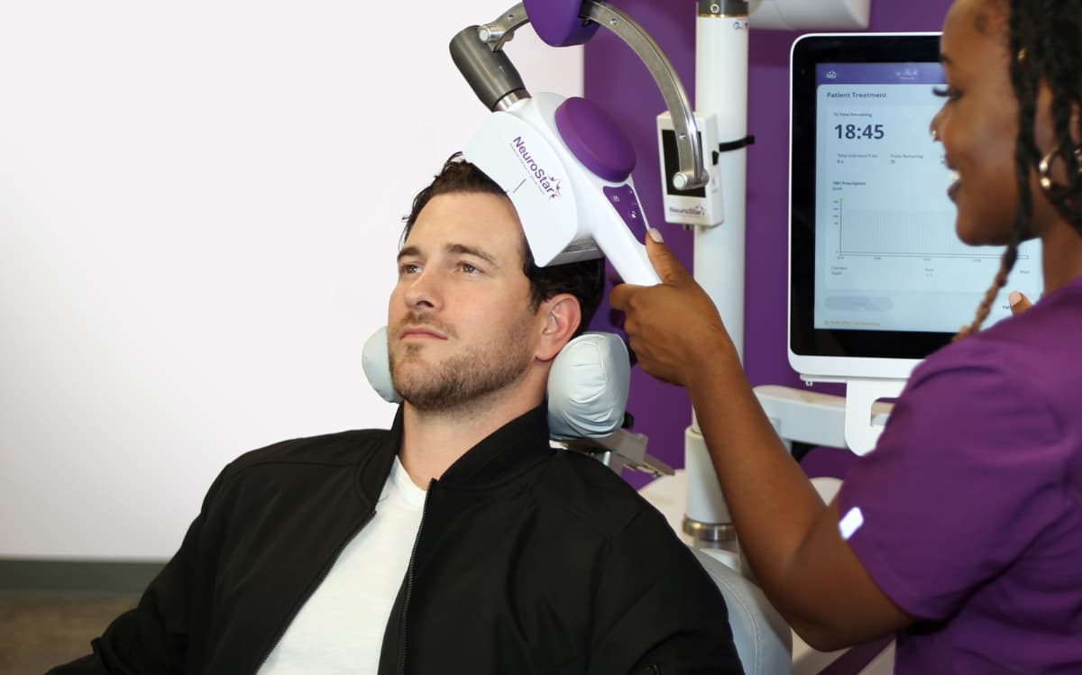 Clinician oversees NeuroStar TMS therapy, a key consideration for equipping a mental health clinic
